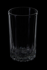 Empty tall glass on black background