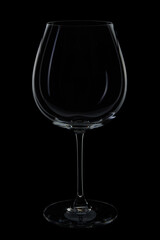 Empty wine glass on black background
