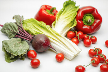 Assortment of Fresh Red Vegetables and Salad Greens