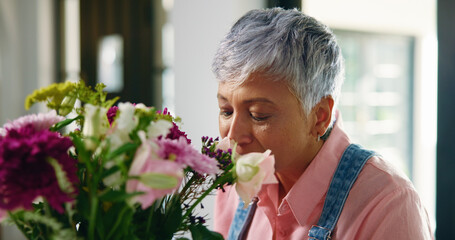 Smile, home and senior woman with flowers, bouquet present and floral aroma. Pensioner, apartment...
