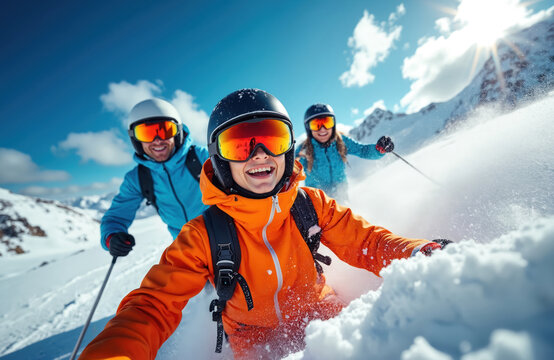 Group skiers have fun, enjoy winter snow resort. Smiling, laughing people wear goggles, helmets. Blue sky, mountains background. Friends on ski vacation, together, active lifestyle.