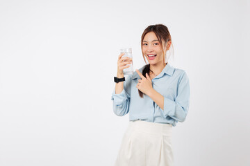 Happy Asian woman with water glass, holding and pointing finger smiles for health showing water for...