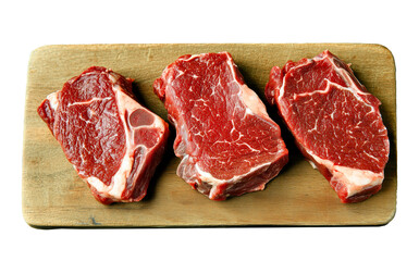 Wooden cutting board with three raw steaks on transparent background