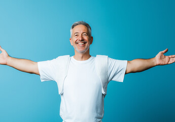 Excited Man in White T-Shirt and Jeans Pointing Left – Advertising Banner Mockup, Blue Background, High-Resolution Stock Photo for Marketing & Promotional Designs