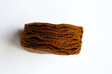 Fermented soybean discs, known as “Thua Nao,” a traditional Thai seasoning used to enhance flavor in Northern cuisine.