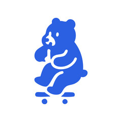 A blue cartoon bear sitting on a skateboard