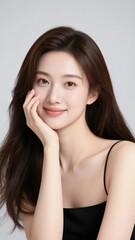 Fototapeta premium Beautiful Woman with Hand on Cheek