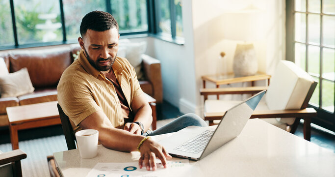 Data, freelancer and man with paperwork for problem solving, financial analysis or reading. Chart, hybrid work and serious person in home office for thinking, review metrics and stats for investment