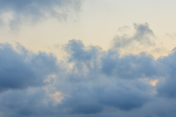 blue sky with clouds and sun light behind the clouds