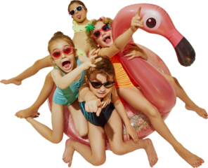 A group of kids in swimsuits and sunglasses excitedly point and laugh while piled on a pink inflatable flamingo. Concept of childlike joy, festival atmosphere and summer event promotion