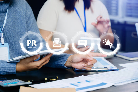 PR, Public relations concept. hands using laptop and tablet with public relations icon for communication advertising marketing strategy.