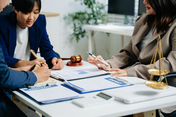 business people and lawyers discussing contract papers sitting at the table. Concepts of law,...