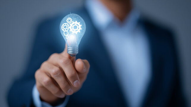 Businessman Innovating with Lightbulb and Cogs for Growth Ideas