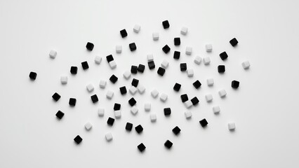 A scattered arrangement of black and white cubes creates a striking contrast on a minimalist background.