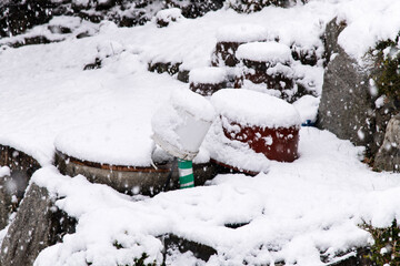 snow-covered outdoor washing area on a snowy day