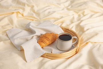 Tray with delicious breakfast on bed indoors. Space for text
