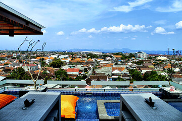 Rooftop Pool Paradise
Escape to luxury! This stunning photo captures a shimmering rooftop pool...