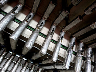 Industrial Metal Pipes on the Walls in a Car Park Building