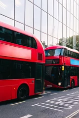 Fototapeten Red double-decker buses parked on london street near modern building © Angel Santana