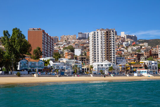 Panorama of city of Annaba - view from Mediterranean Sea. Beach and modern houses on shore of the bay
