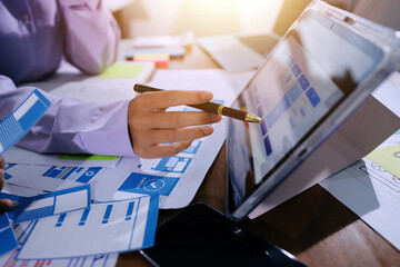 Close up ux developer and ui designer brainstorming about mobile app interface wireframe design on...