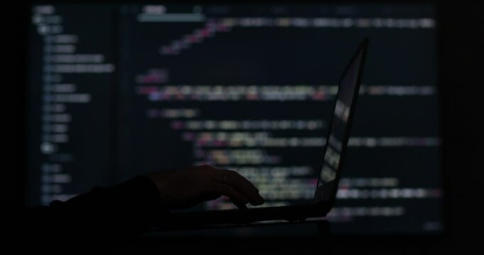 IT engineer, software developer, programmer interacts with a chatbot by creating code. Face Hacking System. Hacker attack concept.