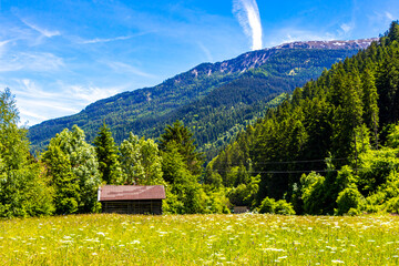 Austria alpine mountain landscape panorama with blue sky and nature.