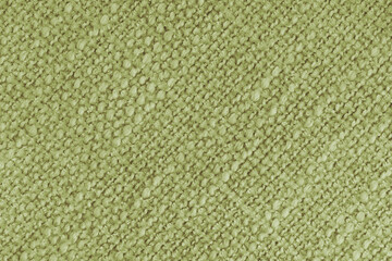 Close up, macro of khaki woven fabric with detailed texture and diagonal pattern. Textile, cloth,...