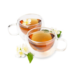 Glass cups of tea and beautiful jasmine flowers on white background