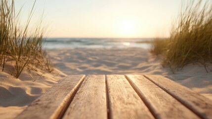 A scenic view of a wooden walkway bordered by grass leads toward the tranquil sunset by the beach, symbolizing peace and the beauty of nature's environment.