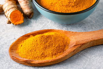 Turmeric with its magnificent orange color on a vintage white background
