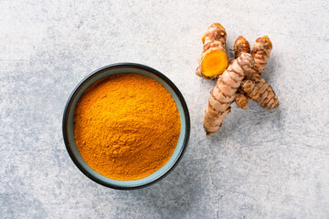 Turmeric with its magnificent orange color on a vintage white background