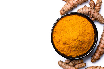 Turmeric with its magnificent orange color on a white background
