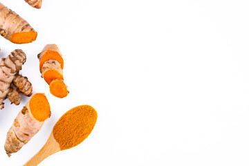 Turmeric with its magnificent orange color on a white background