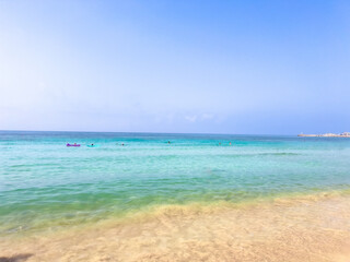 Turquoise sea and sandy beaches in Ayia Napa, Cyprus, one of the island top summer resorts. Clear water and Blue Flag beaches. Concept of Mediterranean vacation and coastal relaxation