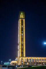 Night view of minaret of largest mosque in Algeria, tallest in the world, with Arab-Muslim decor....