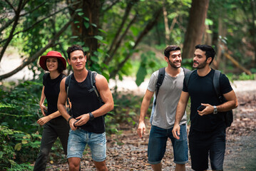 Diverse Group of People Hiking on Scenic Tropical Trail and Enjoying Active Summer Vacation in the Forest Together