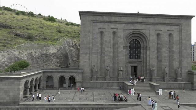 Drone view of The Matenadaran with many visitors on the steps and plaza in Yerevan, Armenia