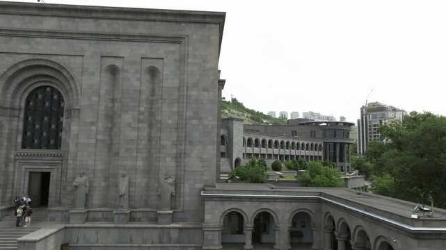 Drone view of The Matenadaran with many visitors on the steps in Yerevan, Armenia