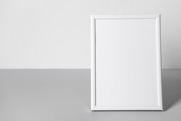 Beautiful blank photo frame on white background