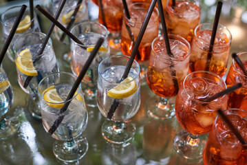 Refreshing aperol spritz and gin tonic cocktails served