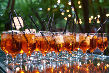Glasses with refreshing aperol cocktails served