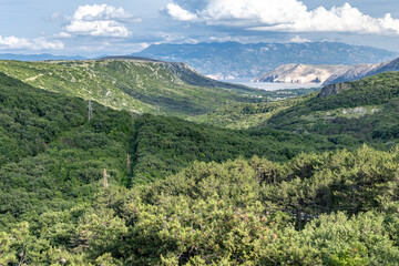 Monument symbolizing the Glagolitic alphabet, view of the panorama of the island of KRK