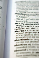 Close Up Of English Dictionary Page With Word - Abort