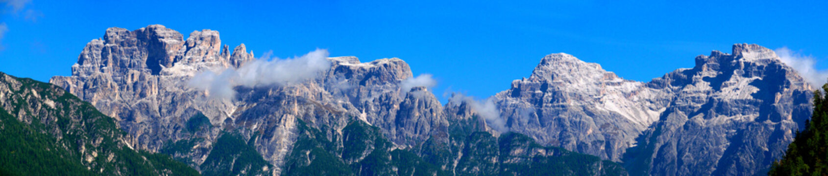 Tre Cime di Lavaredo Dolomites classic landscape view. Famous mountain summits of the Alps. Dolomiti Alps beautiful landscape with blue sky in summer. Hiking and trekking in the Dolomite Alps de Sesto