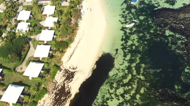 Beach and waterfront of tropical resort on Tokoriti island in aerial view coral reefs Fiji.
