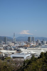 Urban Horizon: A captivating panoramic view of a modern city skyline stretching beneath a clear,...