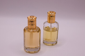 two bottles of perfume on white background