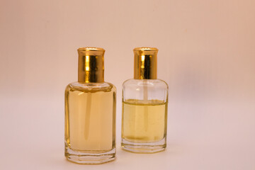 two bottles of perfume on white background