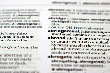 Close Up Of English Dictionary Page With Word - Abroad